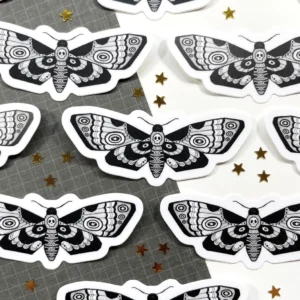 A close up of many stickers with a butterfly design