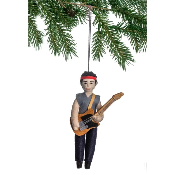 A christmas ornament of a man holding a guitar.