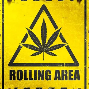 A yellow sign with a marijuana leaf on it.