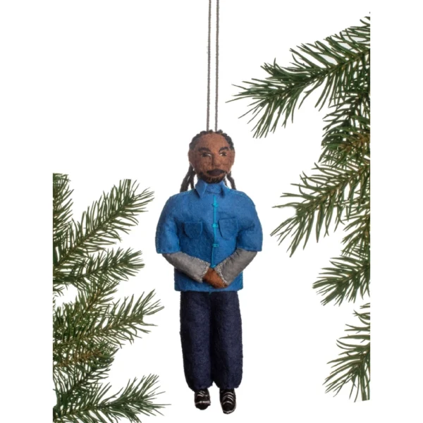 A man in blue shirt and jeans hanging from tree.