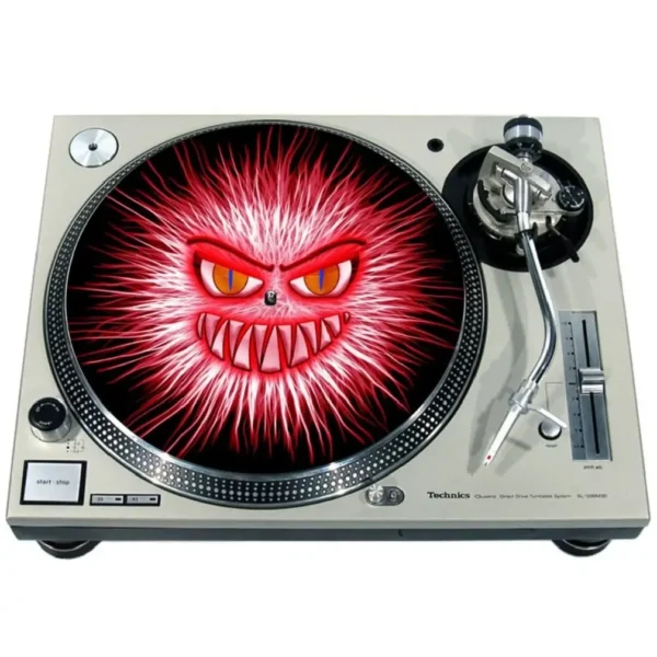 A white dj turntable with a red evil face on it.