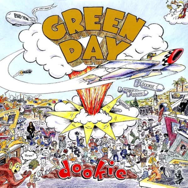 A green day album cover with the band 's name and logo.